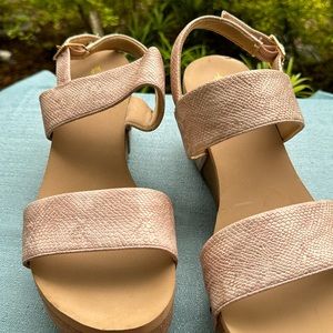 Volatile women’s rose gold snake print wedge sandals